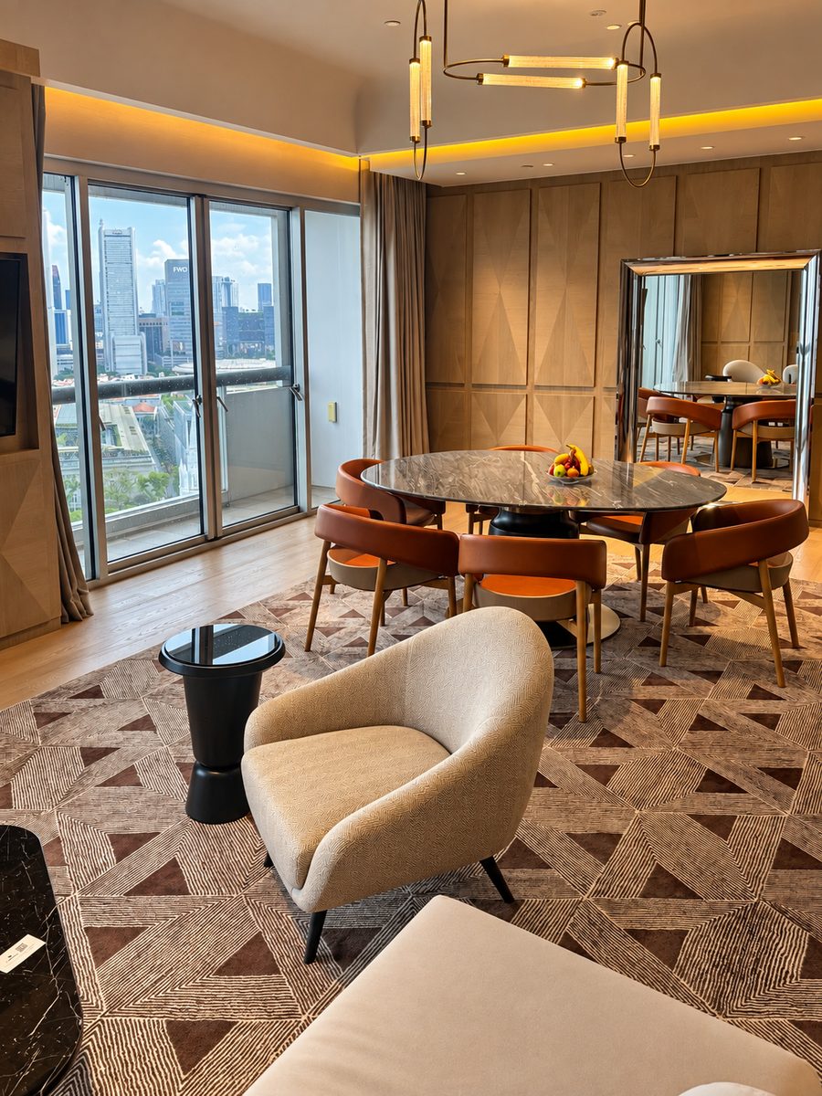 Fairmont Singapore, suite dining room with a city view