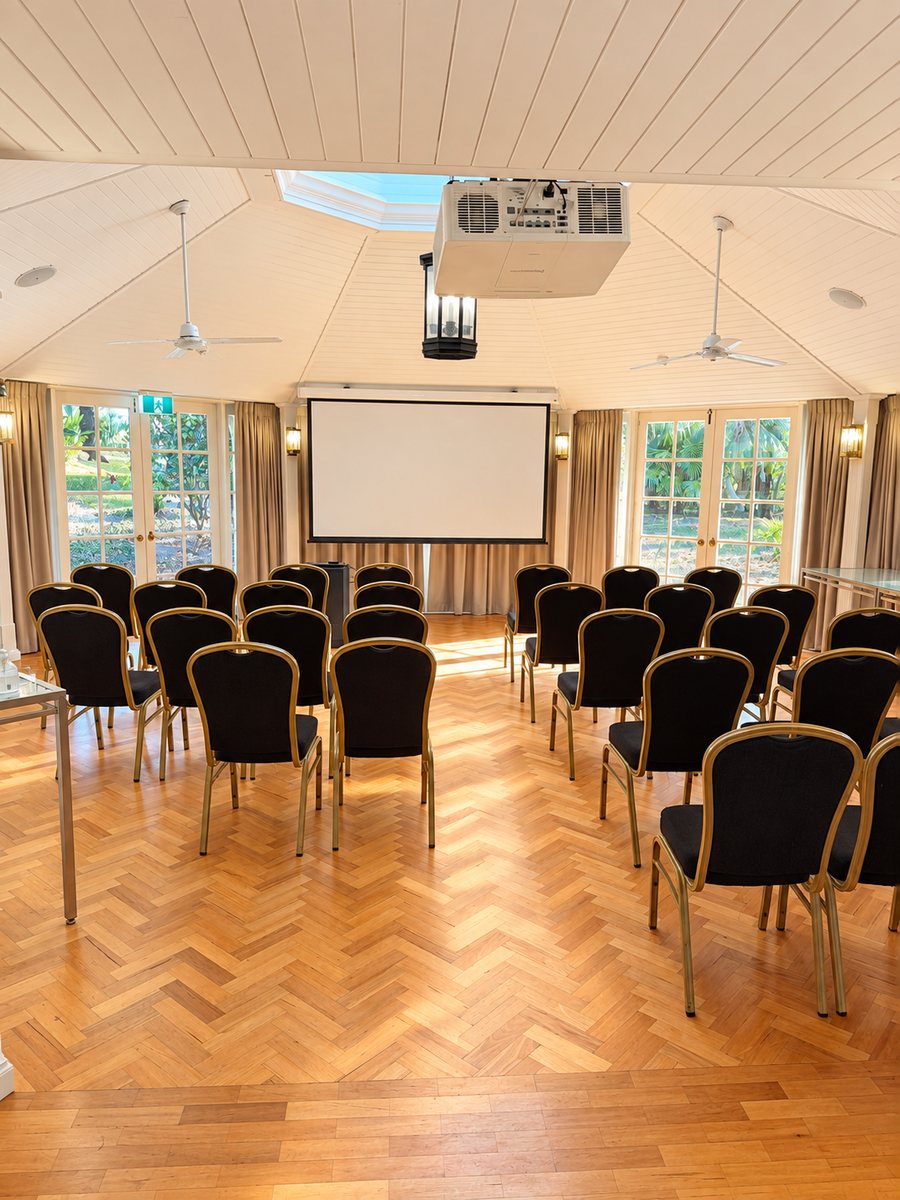 InterContinental Sanctuary Cove Resort, meeting room set theatre style facing a screen, with French doors to the garden on both sides