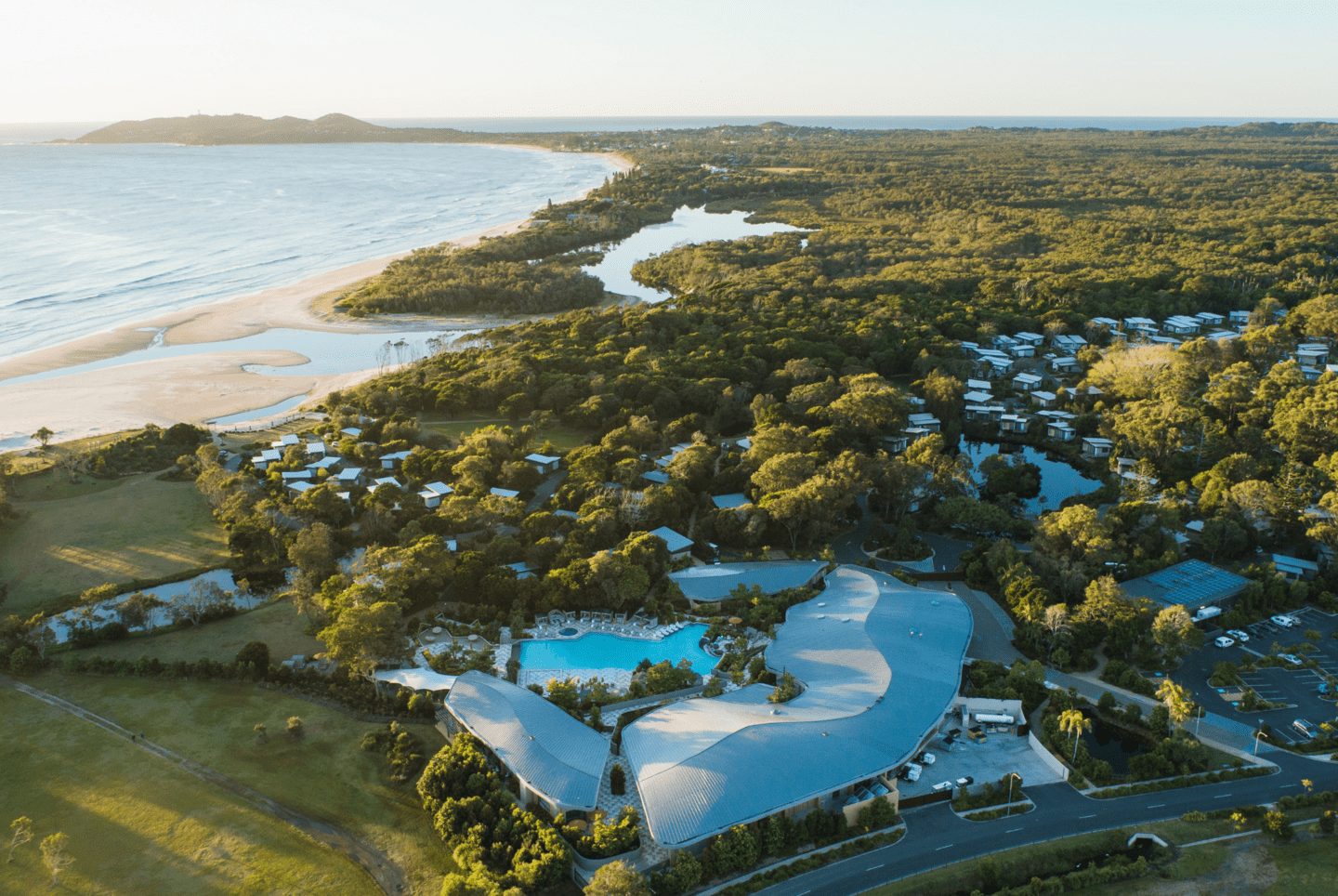 Elements of Byron from the air, the resort, lagoon and villas behind Belongil Beach